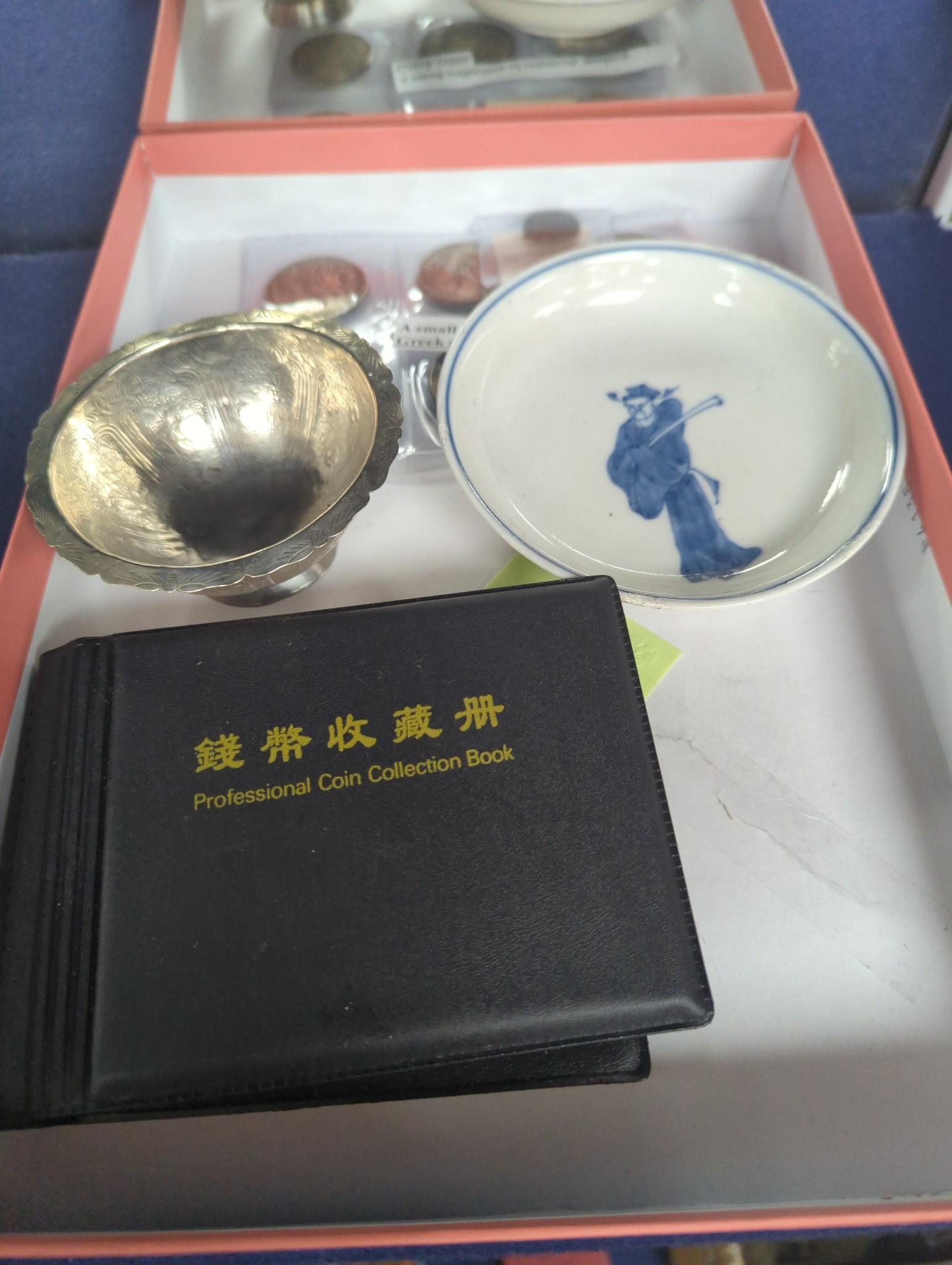 A Japanese porcelain figure of a horse, a Chinese blue and white dish, a Southeast Asian metal bowl and various reproduction coins